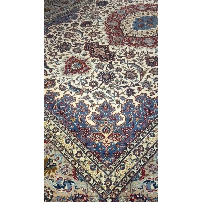 "Hand-knotted Persian rug showcasing detailed floral patterns."