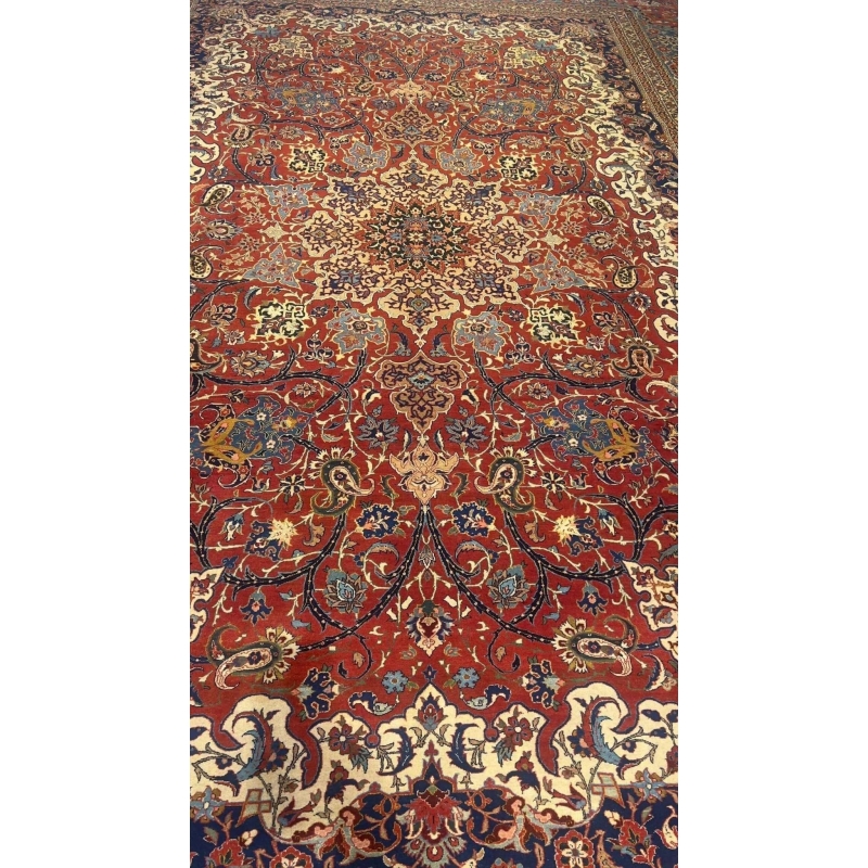 "100-year-old Isfahan rug with natural dyes, showcasing classic Persian craftsmanship and medallion design"