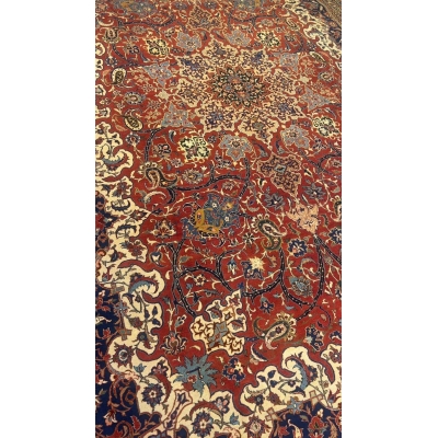 "Antique Persian rug with silk and wool, hand-knotted in Isfahan with vibrant floral patterns"