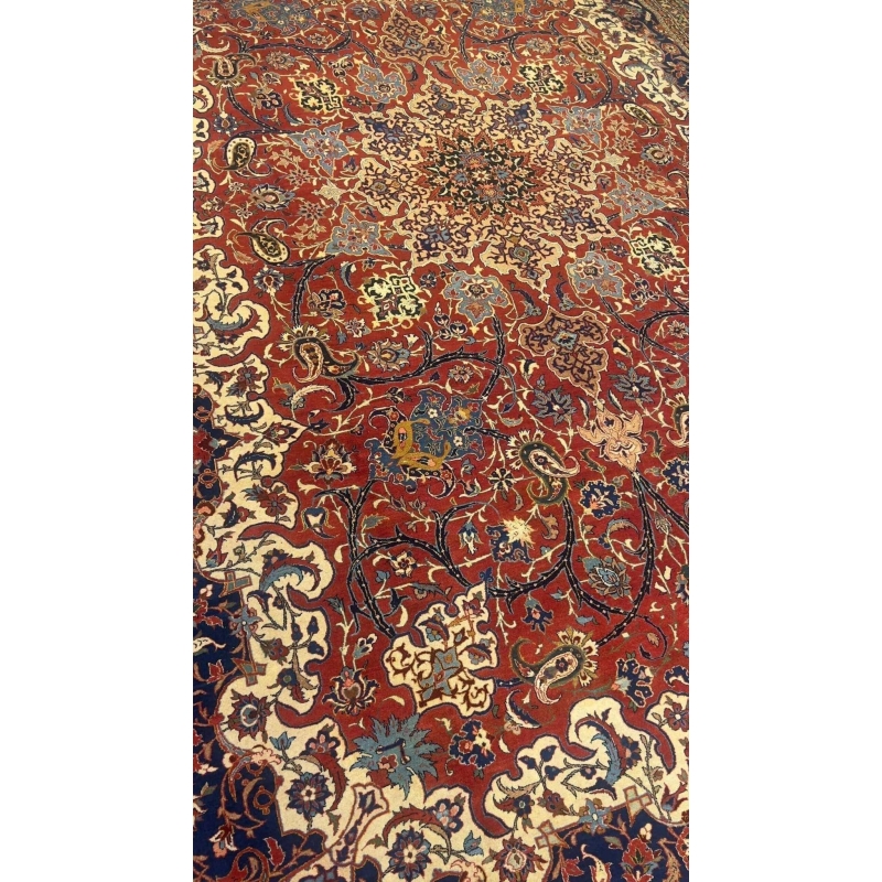 "Antique Persian rug with silk and wool, hand-knotted in Isfahan with vibrant floral patterns"