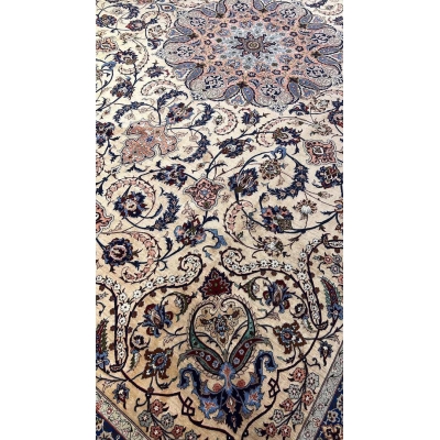 Close-up of the floral patterns on the Handcrafted Silk Rufugaran Rug