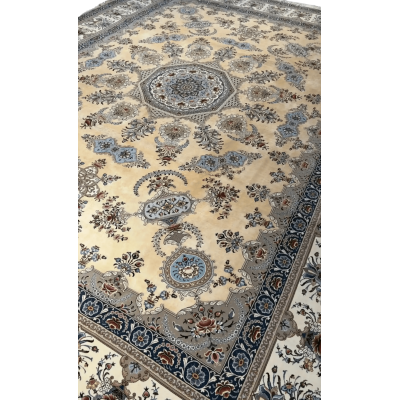 Elegant Persian Isfahan rug in soft beige and blue hues, detailed with a central medallion and bordered with floral motifs.