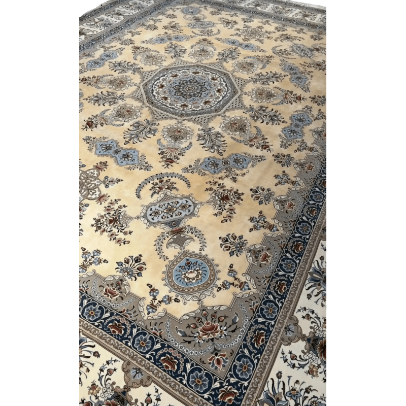 Elegant Persian Isfahan rug in soft beige and blue hues, detailed with a central medallion and bordered with floral motifs.