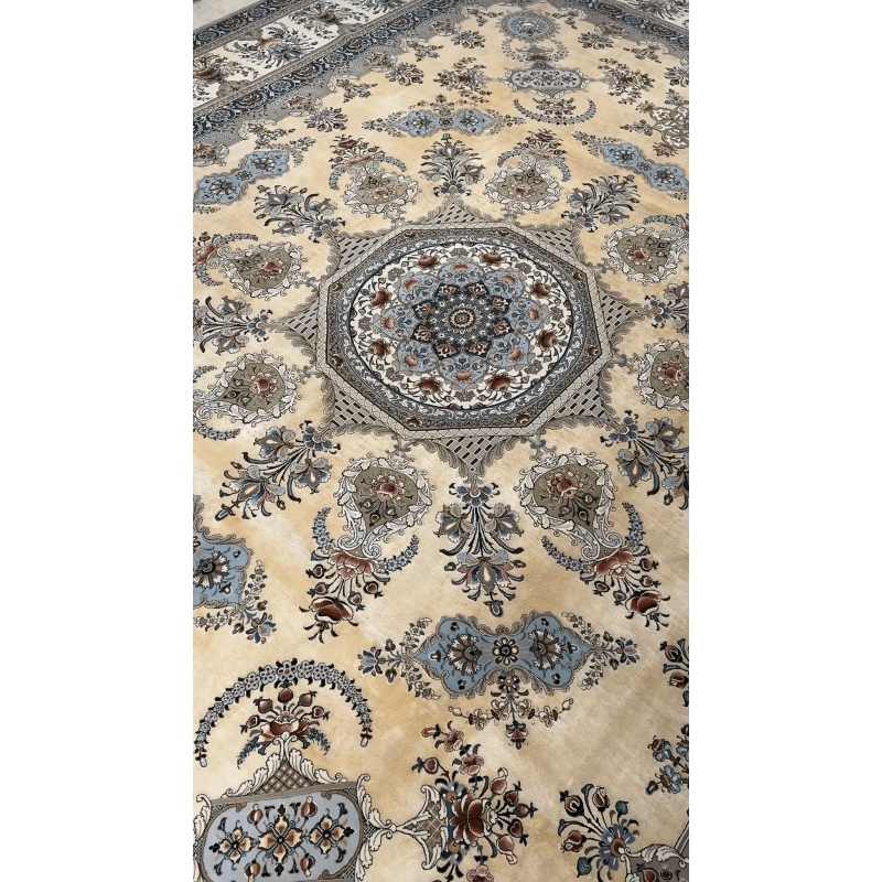 Close-up of the corner design of an artisan Isfahan rug, highlighting the intricate floral patterns in silk and wool.