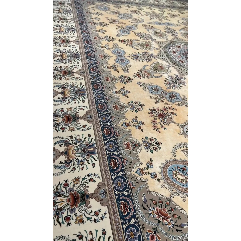 Detailed shot of the master craftsmanship of an Isfahan Persian rug, with a central medallion and delicate surrounding floral motifs.