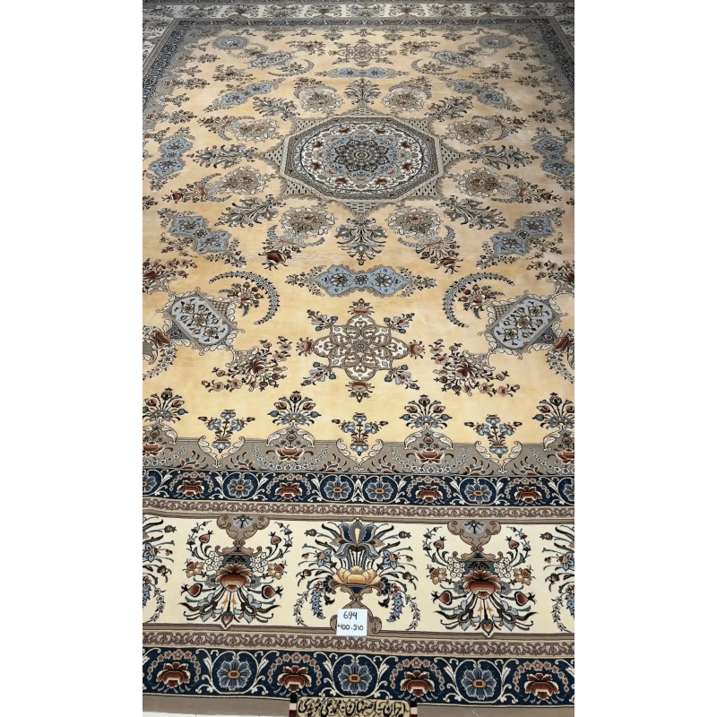 Intricately hand-knotted Isfahan Persian rug with floral medallion pattern in silk and wool, featuring soft neutral tones.