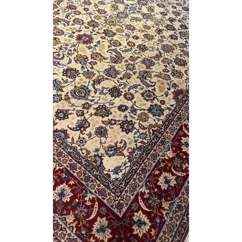 Detailed view of an oriental rug with prominent red edging and subtle blue accents