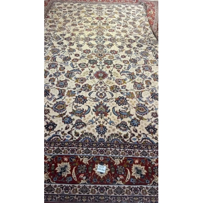 Oriental rug with a detailed floral motif set against a rich, textured background