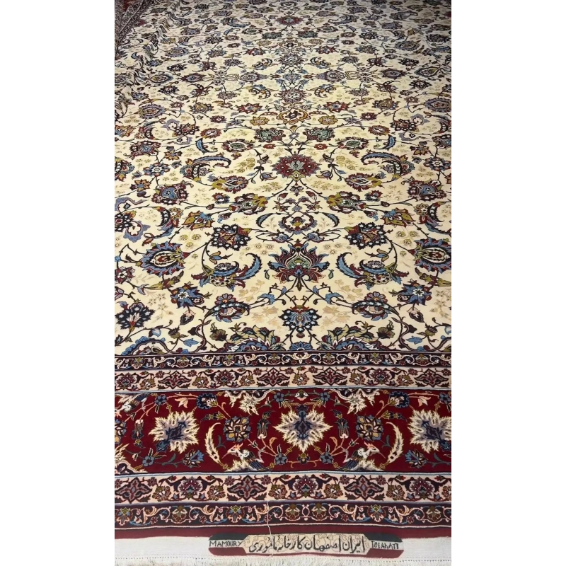 An expansive oriental carpet featuring intricate red and blue borders
