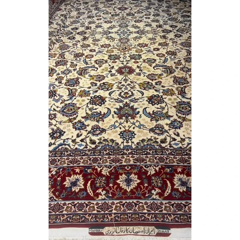 An expansive oriental carpet featuring intricate red and blue borders