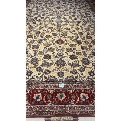 Close-up of an oriental carpet highlighting the interplay of red and blue in the border design