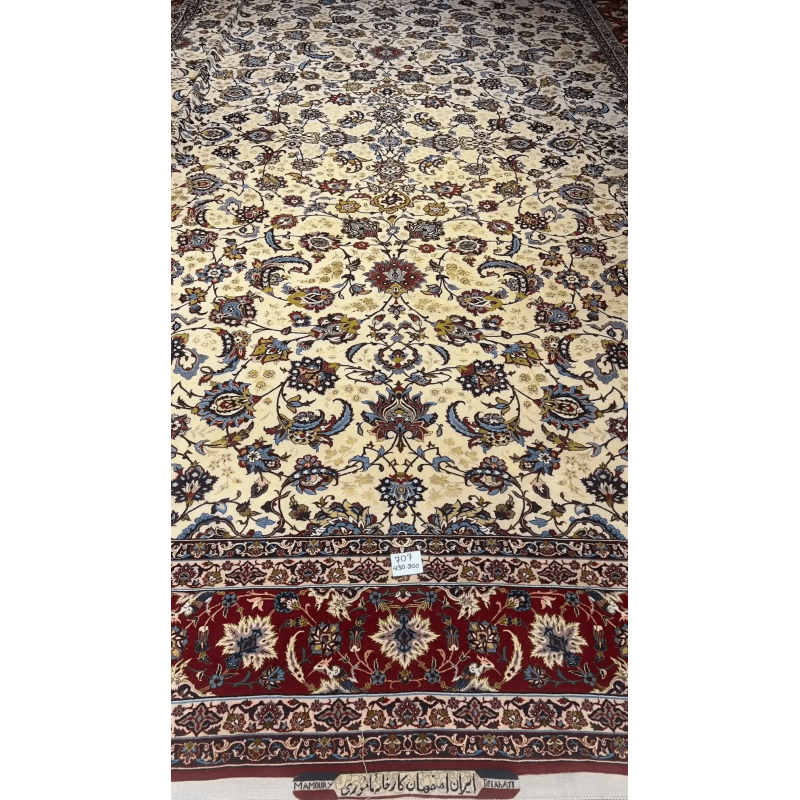 Close-up of an oriental carpet highlighting the interplay of red and blue in the border design