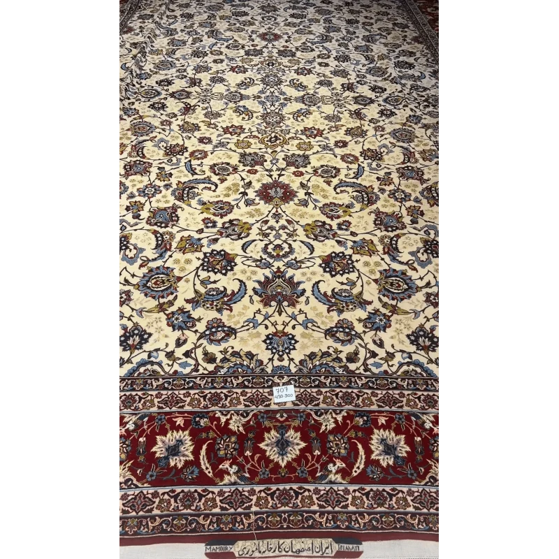 Close-up of an oriental carpet highlighting the interplay of red and blue in the border design