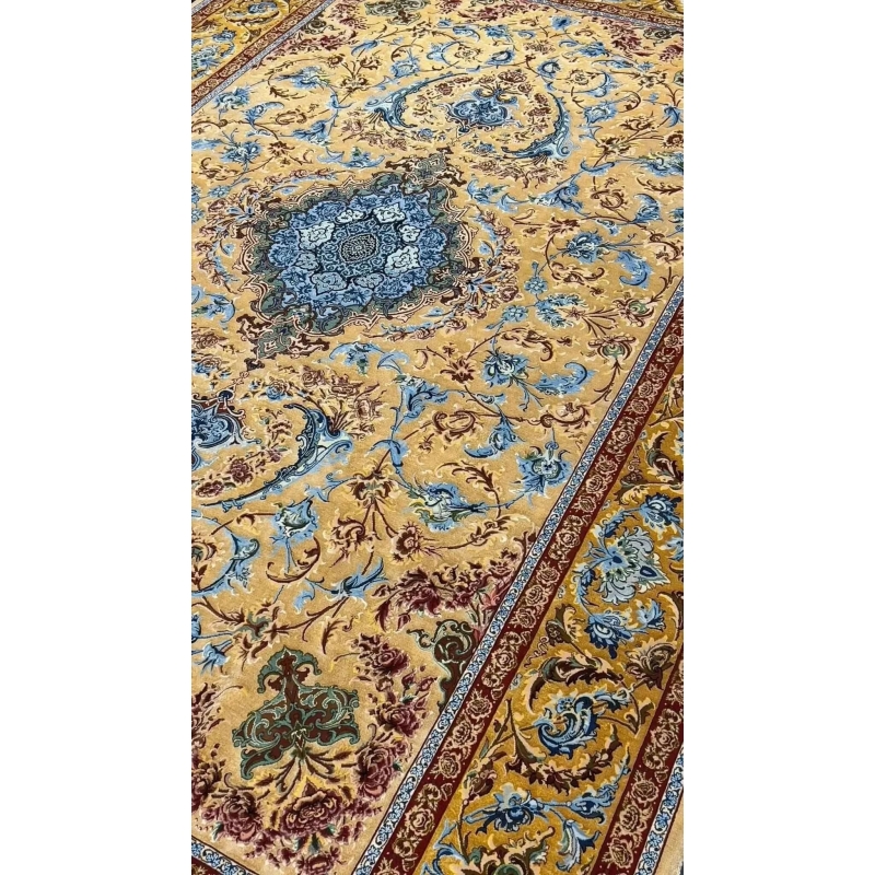 Elegant Mohaghegh silk carpet featuring blue and golden motifs