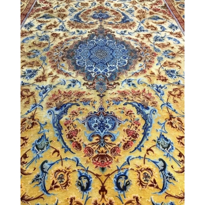 Mohaghegh's fine silk carpet with sophisticated blue and golden ornamentation