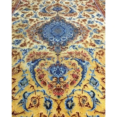Mohaghegh's fine silk carpet with sophisticated blue and golden ornamentation