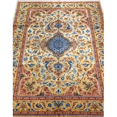 Luxurious Mohaghegh silk carpet with intricate blue, yellow, and red patterns