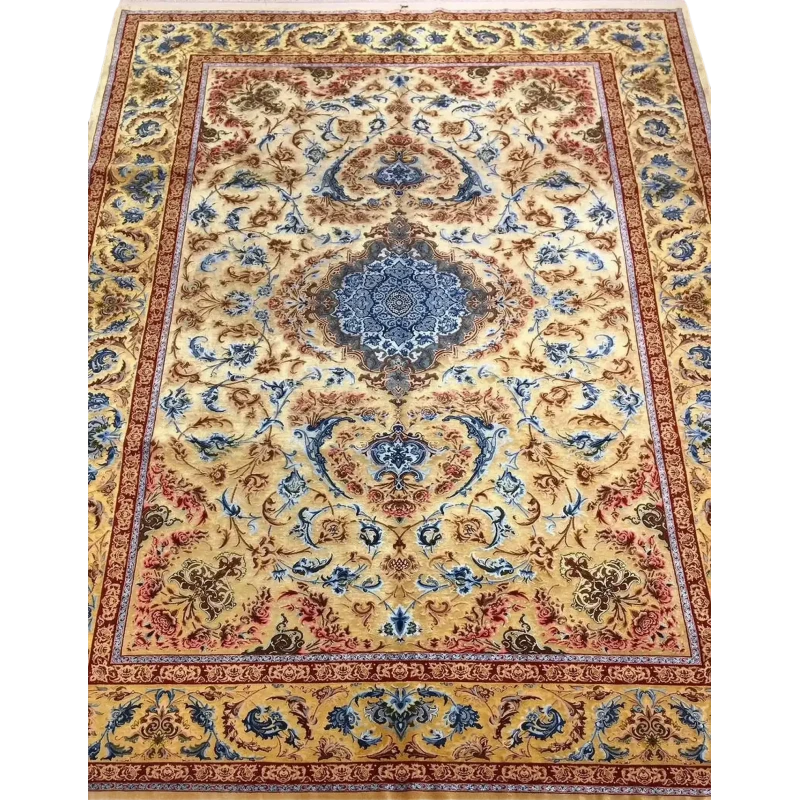 Luxurious Mohaghegh silk carpet with intricate blue, yellow, and red patterns