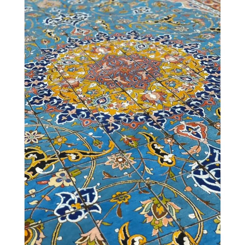 "Master Haghighie’s fine Persian Isfahan rug, featuring rich colors and complex designs, crafted from wool and silk."