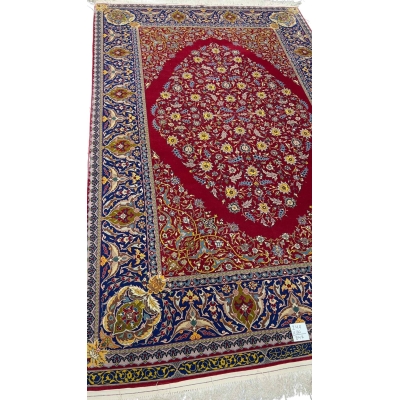 "Master Haghieghie’s handwoven red Persian rug with silk and wool pile"