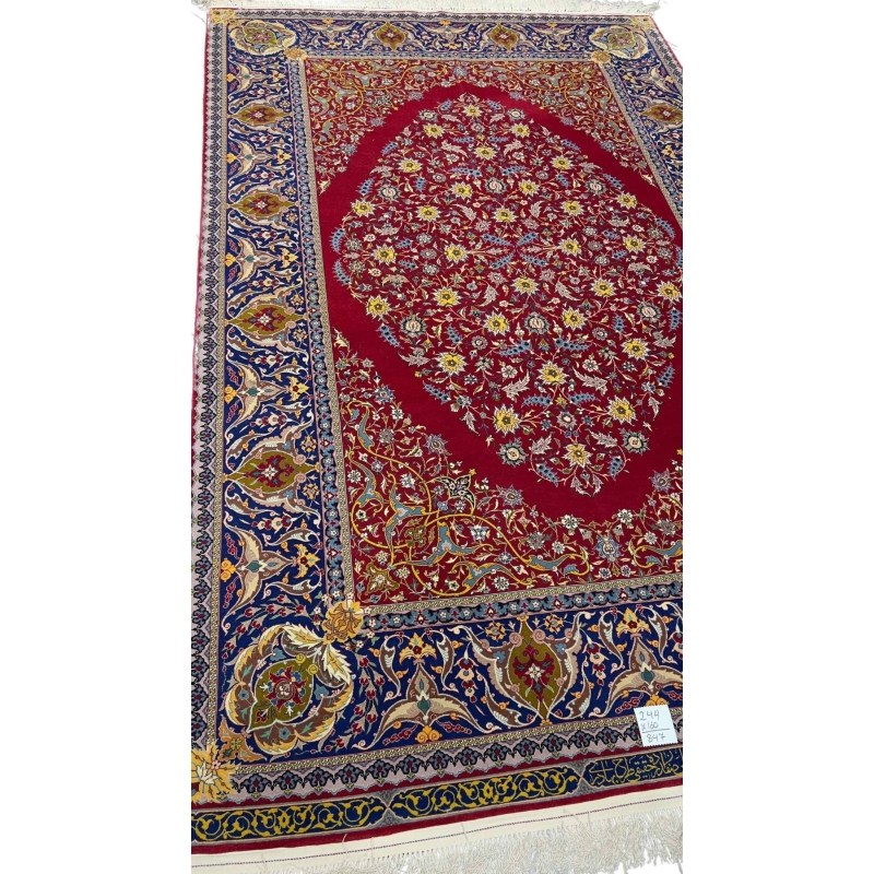 "Master Haghieghie’s handwoven red Persian rug with silk and wool pile"