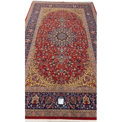 Elegant Isfahan rug featuring intricate floral motifs and a striking central medallion.