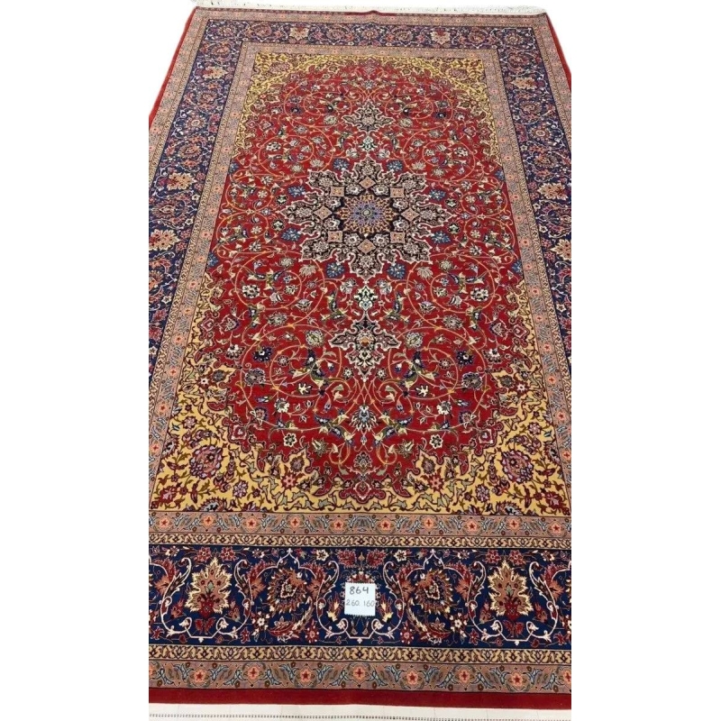 Elegant Isfahan rug featuring intricate floral motifs and a striking central medallion.