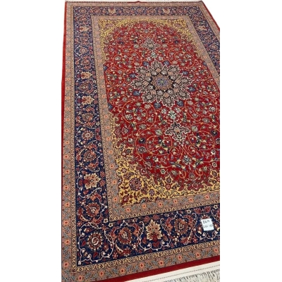 High-quality Persian rug designed with floral patterns and golden highlights.