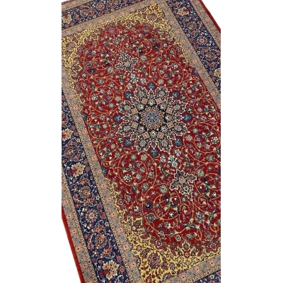Elegant Isfahan rug featuring intricate floral motifs and a striking central medallion.