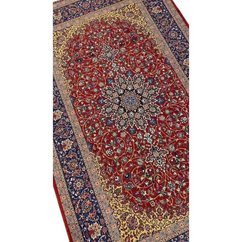 Elegant Isfahan rug featuring intricate floral motifs and a striking central medallion.