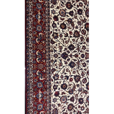 70-year-old red and beige Persian rug made of wool and silk with intricate design