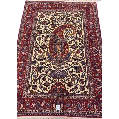 80-year-old antique Persian rug with intricate floral designs, 210 x 145 cm.