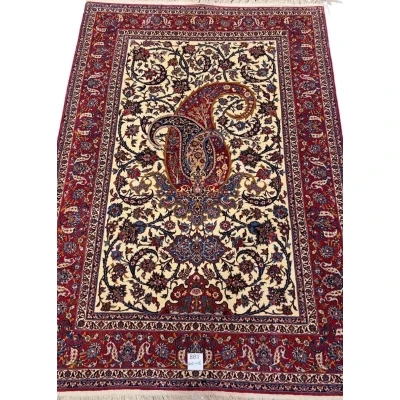 80-year-old antique Persian rug with intricate floral designs, 210 x 145 cm.