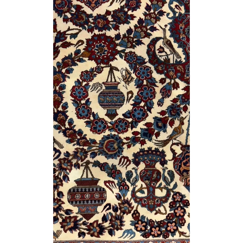 Antique 75-year-old Persian rug with intricate floral patterns