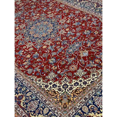 "Persian masterpiece rug with vibrant red field and detailed borders."