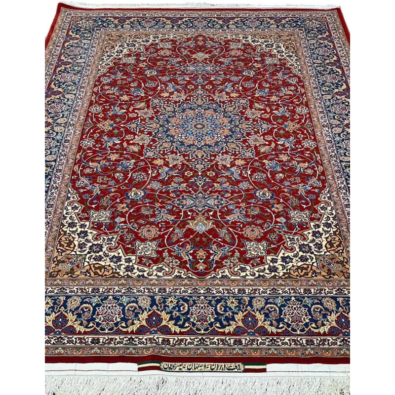 "Handwoven Isfahan rug by Master Bagher Seirafian with red, navy, and cream tones."