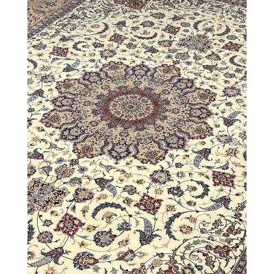 "Luxury Persian rug with cream, blue, and burgundy hues, crafted in Isfahan, Iran."