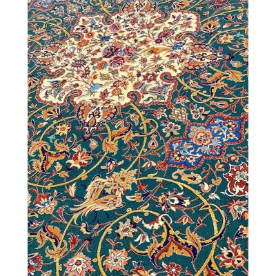 Handmade emerald green Seirafian rug with intricate floral and vine patterns.