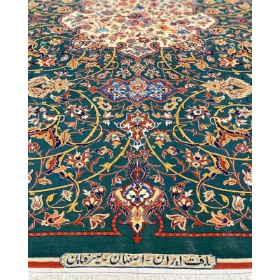 Hand-knotted Isfahan rug featuring gold, burgundy, and ivory floral patterns.