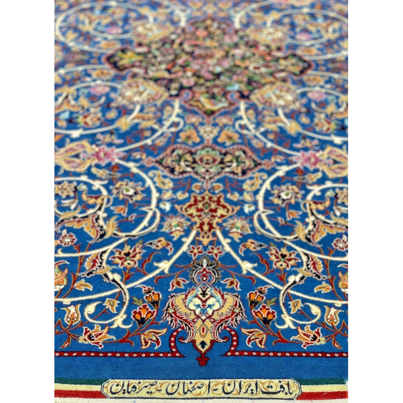 Luxurious Seirafian rug with a blend of silk and wool on a vibrant blue base.