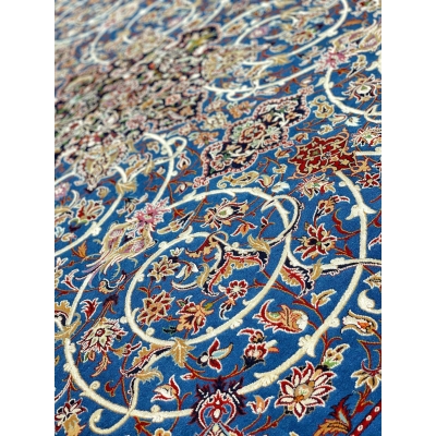 Elegant Bagher Seirafian rug with a timeless royal blue base and floral designs.