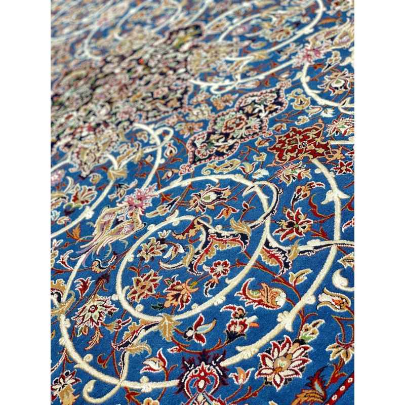 Elegant Bagher Seirafian rug with a timeless royal blue base and floral designs.