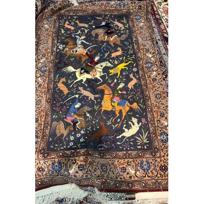 Exquisite hand-knotted Seirafian rug with a detailed central hunting motif.