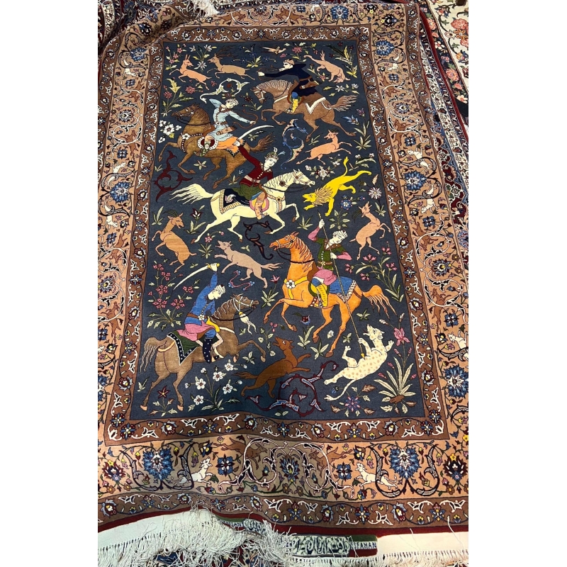 Exquisite hand-knotted Seirafian rug with a detailed central hunting motif.