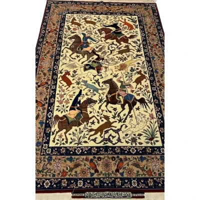 Full view of a hand-knotted Seirafian hunting scene rug, crafted by Master Ahmad Seirafian with silk and wool.
