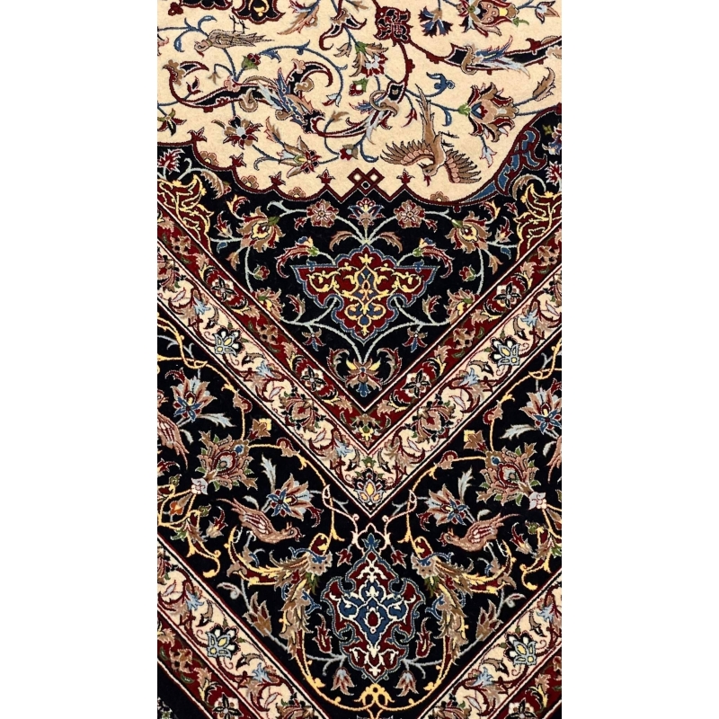 Elegant wool and silk Persian rug featuring vibrant colors and a central medallion design.
