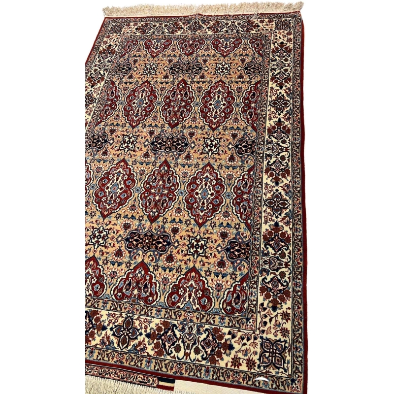"40-year-old Persian rug by Master Ahmad Seirafian, featuring a luxurious blend of wool and silk in vibrant natural colors."