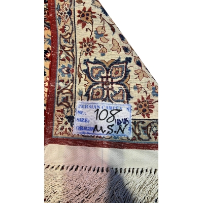 "Backside of a vintage Ahmad Seirafian Persian rug, revealing the intricate hand-knotted silk warp and exceptional craftsmanship."