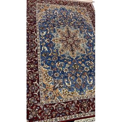 "Luxurious Seirafian wool and silk rug featuring detailed floral designs, natural-dyed in blue and beige, handwoven in Isfahan, Iran."