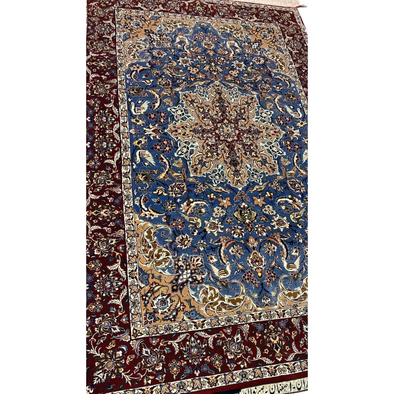 "Luxurious Seirafian wool and silk rug featuring detailed floral designs, natural-dyed in blue and beige, handwoven in Isfahan, Iran."
